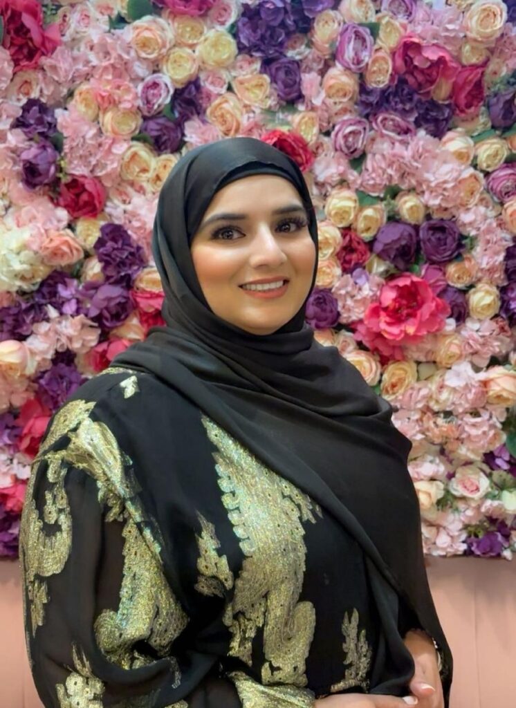 Woman in hijab against floral backdrop